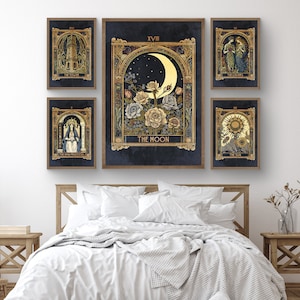 May include: Set of six framed tarot card prints with gold accents. The prints feature illustrations of the Tower, The Empress, The Moon, The Lovers, The Sun, and The High Priestess. Each print has a title and Roman numeral.