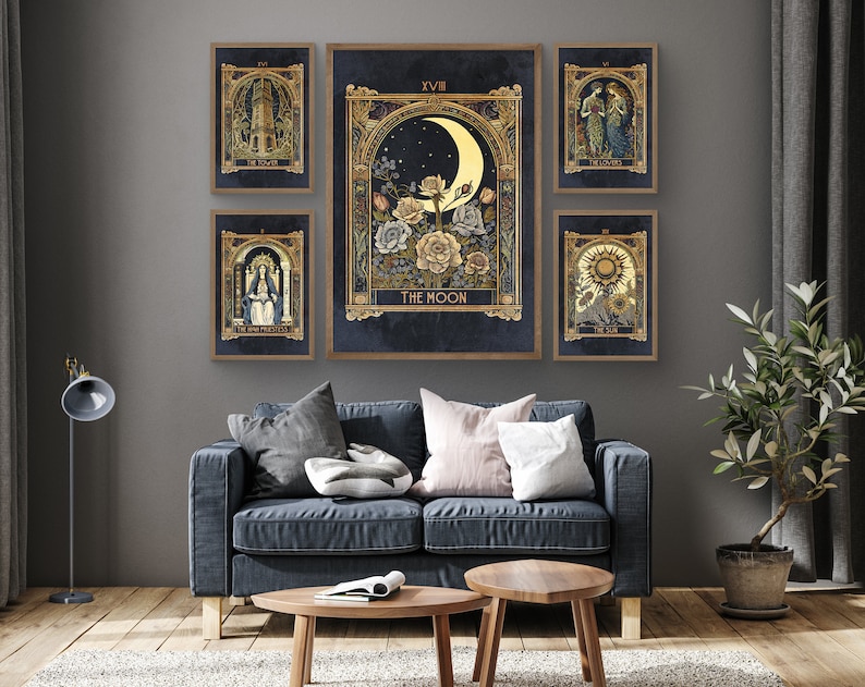 May include: A set of 7 tarot cards featuring illustrations of the Tower, The Lovers, The Moon, The High Priestess, The Sun, and The World. The cards are framed in gold and have a dark blue background.