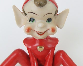 1950 年代の妖精の置物、陶器の妖精、赤い妖精のスーツ、金色のハート