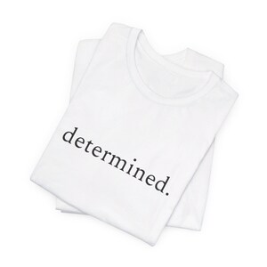 entschlossen - Ein Wort Minimalistisches Unisex Jersey Kurzarm-T-Shirt