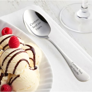 May include: A set of three ceramic nesting bowls in shades of blue, green, and white. The bowls feature a speckled glaze and a simple, modern design. The largest bowl is approximately 7 inches in diameter.