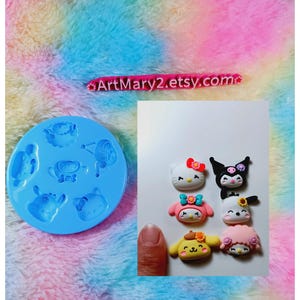 May include: A blue silicone mold with seven different character shapes. The mold is filled with colorful polymer clay characters, including Hello Kitty, My Melody, and Pompompurin.