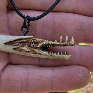 Dragon Hand  carved antler carving bone necklace hand carved antler Art by Josh Carte carving of a face made in Ohio antler jewelry art