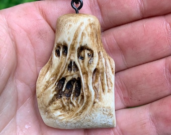 Skull antler carving hand carved deer antler macabre dark pendant necklace mountaineer by Josh Carte made in Ohio unique artist sculpture