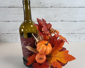 Ramo de botellas de otoño, arreglo de hojas de otoño y calabazas