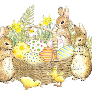 May include: Two brown bunnies stand beside a wicker basket filled with colorful Easter eggs.  Two yellow ducklings are near the basket.  The basket is surrounded by green ferns and yellow daffodils.