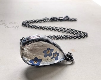 Collar de recuerdo de pelo de mascota: Joya conmemorativa en forma de lágrima con flores de nomeolvides