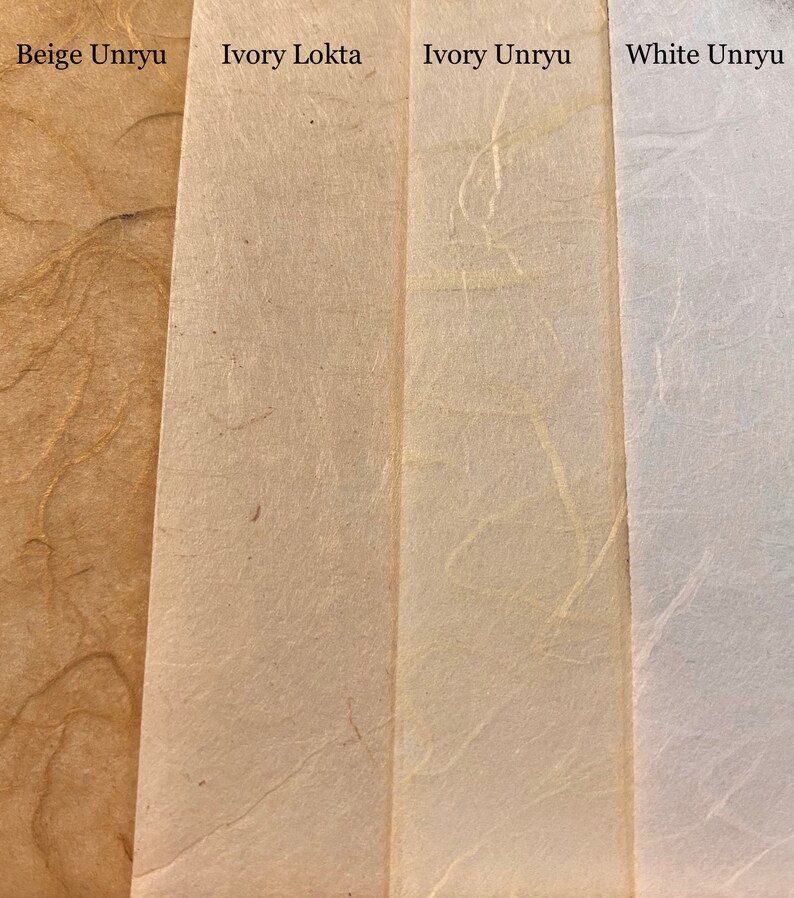 May include: Four samples of paper, from left to right: Beige Unryu, Ivory Lokta, Ivory Unryu, and White Unryu. The paper is textured and has a natural, handmade look.