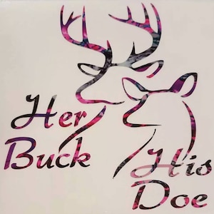 May include: A white background features a graphic design of two deer silhouettes. The buck's antlers and the doe's head are filled with a pink, purple, and blue floral pattern. The words "Her Buck" and "His Doe" are written in cursive.