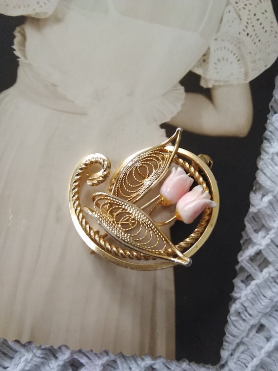 Vintage metal filigree golden colour brooch with t