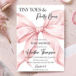 May include: A rectangular baby shower invitation card featuring a large, watercolor-style light pink ribbon bow centered on a white background. The text reads: TINY TOES & Pretty Bows, Please join us for a BABY SHOWER honoring Mom-to-be Heather Thompson, SATURDAY | SEPTEMBER 13TH | 2:00 PM, 123 Street Name, City, RSVP by September 1st at 123-456-7890, Registered at POTTERYBARNKIDS.COM.