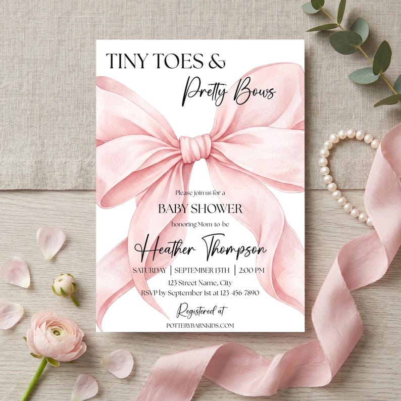 May include: A white rectangular baby shower invitation card featuring a large, soft pink watercolor bow illustration. The text reads: TINY TOES & Pretty Bows, Please join us for a BABY SHOWER honoring Mom-to-be Heather Thompson, SATURDAY | SEPTEMBER 13TH | 2:00 PM, 123 Street Name, City, RSVP by September 1st at 123-456-7890, Registered at POTTERYBARNKIDS.COM.