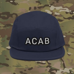 May include: A navy blue 5-panel cap with a white embroidered "ACAB" on the front.