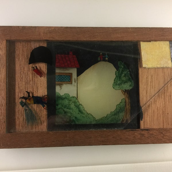 A nice old antique moving Magic lantern slide of Jack and Jill nursery rhyme wood framed.