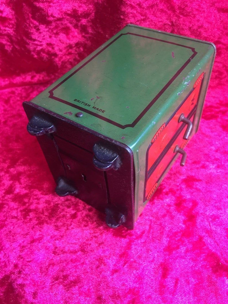 A lovely old vintage money box in the form of a old safe strong box tin with cast base. image 9