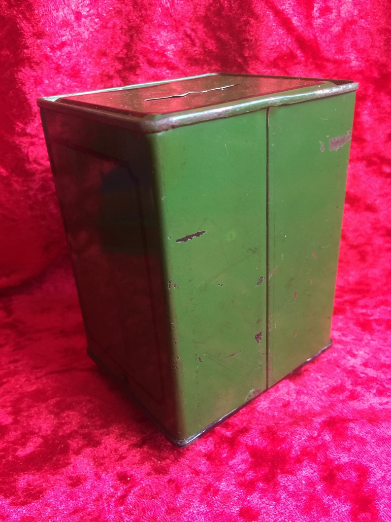 A lovely old vintage money box in the form of a old safe strong box tin with cast base. image 3