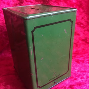 A lovely old vintage money box in the form of a old safe strong box tin with cast base. image 4