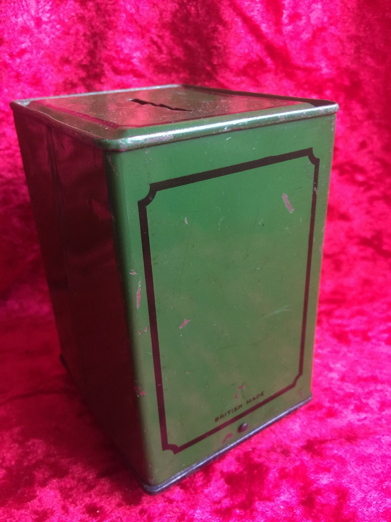 A lovely old vintage money box in the form of a old safe strong box tin with cast base. image 4