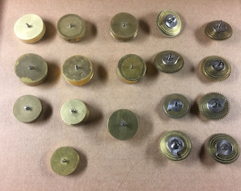 A Collection of old vintage fusee verge pocket watch cones and barrels spares.