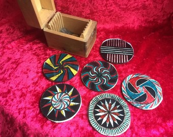 A rare box of six pairs of kaleidoscope chromatrope animated magic lantern glass discs.