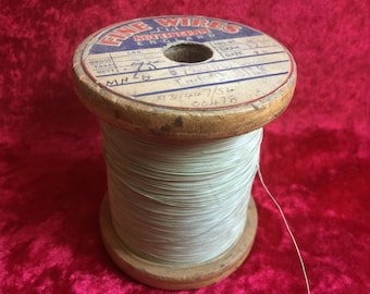 A vintage fine wires wooden spool of electronic 45 gauge .0028 swg 6 strand silk wire.