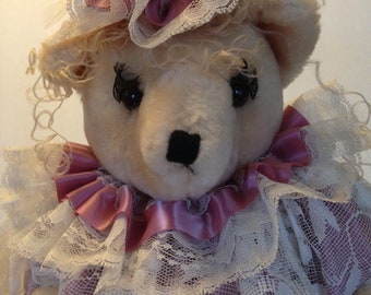 homemade bear doll in pink and white lace dress