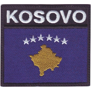 May include: Embroidered patch featuring the flag of Kosovo. The flag is blue with a gold outline of the country's shape and six white stars in a semi-circle above the outline. The patch has a black border and the word "KOSOVO" in white lettering at the top.