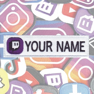May include: White embroidered patch with a purple Twitch logo and the text "YOUR NAME" on a white background. The patch is surrounded by various social media logos.