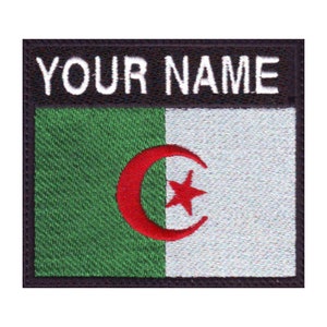 May include: A black and white embroidered patch with the Algerian flag and the text "YOUR NAME" in white.