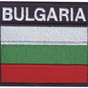 May include: Embroidered patch with the Bulgarian flag. The flag has three horizontal stripes: white, green, and red. The patch has a black border and the word "BULGARIA" in white lettering at the top.