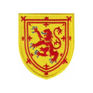 May include: Embroidered patch featuring the Scottish Royal Arms. The design includes a red rampant lion within a red border on a yellow shield. The patch has a yellow border with decorative stitching.