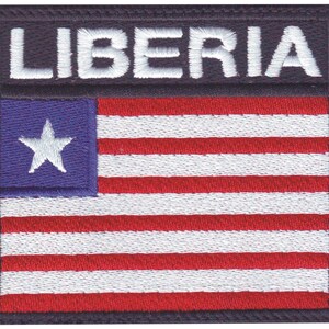 May include: An embroidered patch with the word "LIBERIA" in white text on a black background. The patch features the Liberian flag, which is red, white, and blue with a white star in the blue canton.