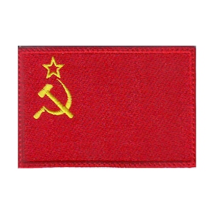 May include: A red embroidered patch with a yellow hammer and sickle and a yellow star.