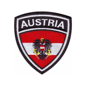 May include: Embroidered patch with the Austrian flag and the word "AUSTRIA" in white lettering on a black background.