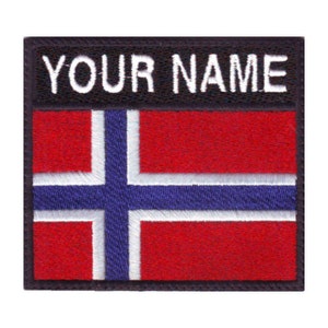 May include: A black and white embroidered patch with the Norwegian flag and the text "YOUR NAME" above the flag.