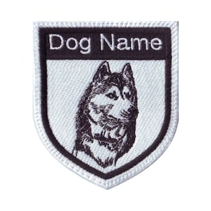 May include: White embroidered patch with a black border. The patch features a black and white husky dog head and the text "Dog Name" in black.