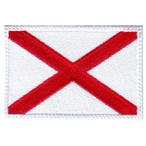 May include: White embroidered patch with a red cross, resembling the flag of Alabama.