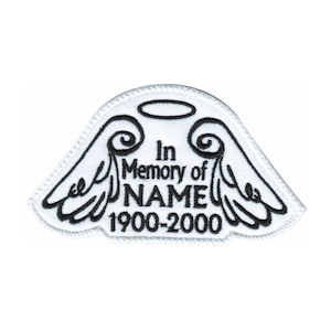 May include: White embroidered patch with angel wings and a halo. The text reads "In Memory of NAME 1900-2000".