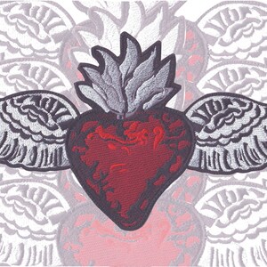 May include: A red heart with a flame on top and wings on either side. The heart is embroidered with a detailed design and the wings are silver.
