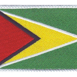 May include: A green, yellow, and red embroidered patch with a white border. The patch features a black triangle with a red triangle inside.