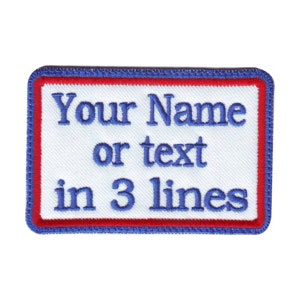 May include: White rectangular embroidered patch with a blue border and red inner border. The text "Your Name or text in 3 lines" is embroidered in blue.