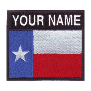 May include: Embroidered patch featuring the Texas state flag with a white star on a blue background, a white stripe, and a red stripe. The patch has a black border with the text "YOUR NAME" in white.