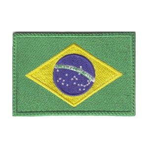 May include: A green, yellow, and blue embroidered patch featuring the flag of Brazil. The flag has a blue circle with white stars in the center, surrounded by a yellow diamond shape on a green background.