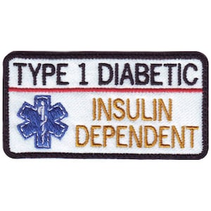 May include: White patch with black border and red stripe. The patch says "Type 1 Diabetic Insulin Dependent" in black and gold lettering. A blue and white star of life is on the left side of the patch.