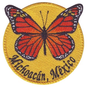 Peut inclure: Un écusson brodé jaune avec un papillon monarque et le texte "Michoacán, Mexique".