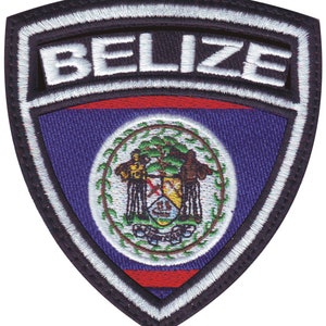 May include: Embroidered patch with a black background and white stitching. The patch features the word "BELIZE" in white lettering and the Belizean flag in the center. The flag is blue with a red stripe at the bottom and a coat of arms in the center.