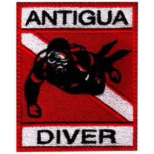 May include: Red and white embroidered patch with a scuba diver silhouette and the text "ANTIGUA DIVER".