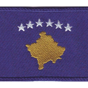 May include: A blue embroidered patch with a gold outline of the country of Kosovo and six white stars.