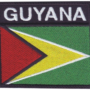 May include: Embroidered patch with the word "GUYANA" in white letters on a black background. The patch features the flag of Guyana, a green background with a yellow and red arrow shape.
