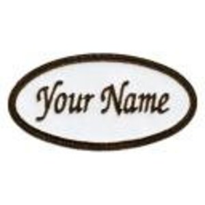 May include: White oval-shaped name tag with a black border. The text "Your Name" is written in a cursive font.